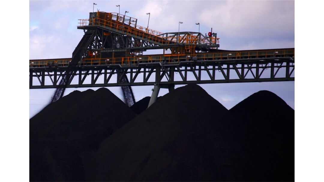 FILE - Coal is unloaded onto large piles at the Ulan Coal mines near the central New South Wales town of Mudgee in Australia, March 8, 2018.