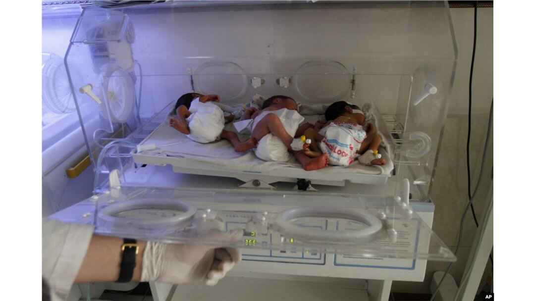 In this May 7, 2015 photo, new born Afghan babies are seen at Indira Gandhi children's hospital, and neonatal ward in Kabul, Afghanistan.