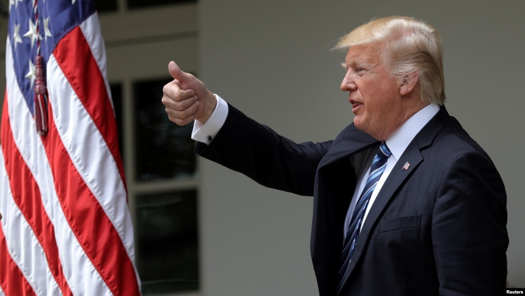 FILE - U.S. President Donald Trump gives a thumbs up during a National Day of Prayer event at the Rose Garden of the White House in Washington, May 4, 2017.