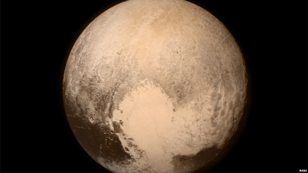 NASA image of Pluto showing heart shaped Tombaugh Regio. Credit: NASA/Johns Hopkins University