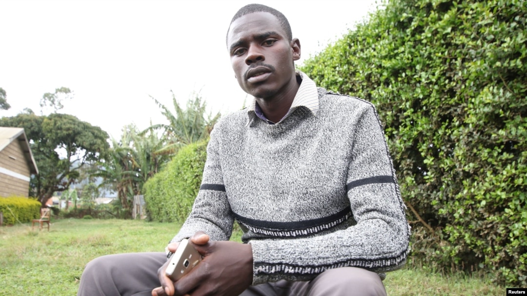 Independent John Paul Mwirigi, who is now a member of the Kenyan parliament, sits outside the tallying center in Maua Girls High School, in Maua, Kenya, Aug. 9, 2017. Mwirigi won the election wearing just one sweater, having no car and not handing out any printed posters.