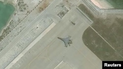 衛星照片顯示，中國2018年5月12日在永興島上部署了殲11戰鬥機。