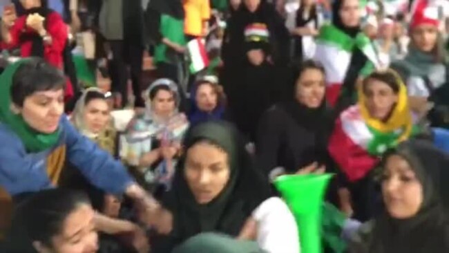 Iranian Policewomen Try to Detain a Female Football Fan