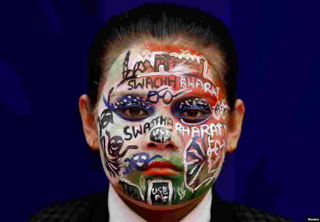 A school girl with painted face participates in an event to mark World Toilet Day in New Delhi, India.