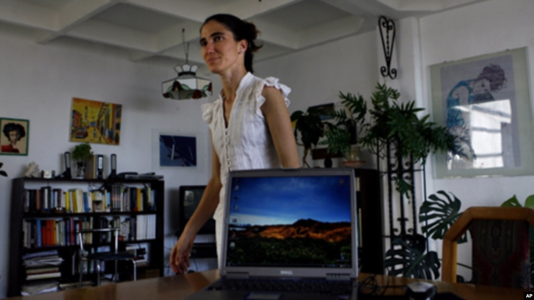 Yoanis Sanchez, who writes the "Generation Y" blog, walks inside her home in Havana, Friday, April 11, 2008. 