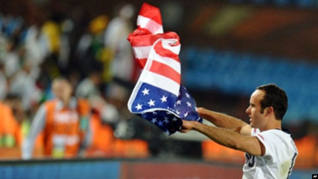US midfielder Landon Donovan waves the US flag after the Group C first round 2010 World Cup football match US versus Algeria at Loftus Verfeld stadium in Tshwane/Pretoria. US won the match 1-0, 23 June 2010.