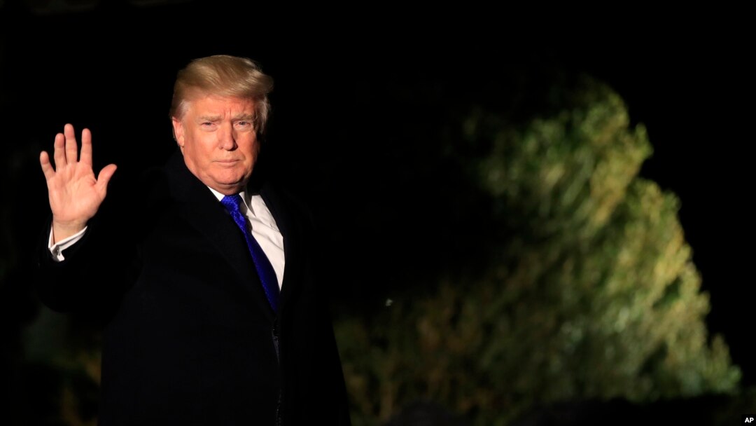 FILE - President Donald Trump waves as he leaves the White House in Washington, Jan. 24, 2018, enroute to Davos, Switzerland, to attend the World Economic Forum.