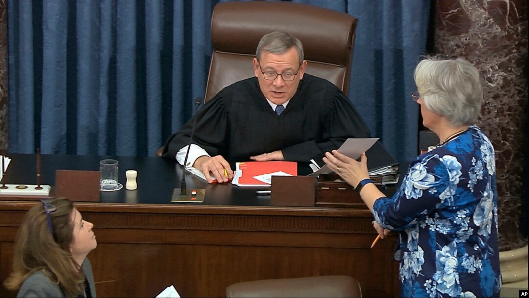 FILE - Supreme Court Chief Justice John Roberts reads the results of the vote on approving rules of impeachment, Jan. 22, 2020.