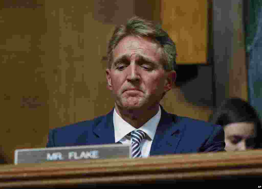 Sen. Jeff Flake speaks during the Senate Judiciary Committee hearing about Brett Kavanaugh's nomination for the Supreme Court. After a flurry of last-minute negotiations, the committee advanced Kavanaugh after agreeing to a call from Flake for a one week.