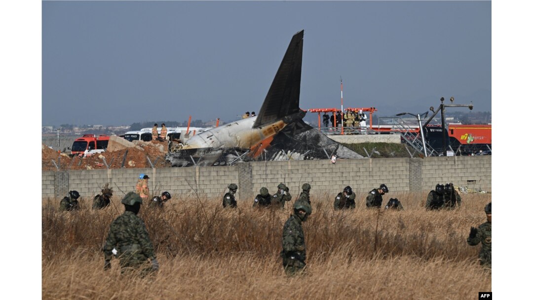 South Korean soldiers search for missing passengers near the wreckage of a Jeju Air Boeing 737-800 series aircraft after the plane crashed and burst into flames at Muan International Airport in South Jeolla Province, South Korea, Dec. 29, 2024.