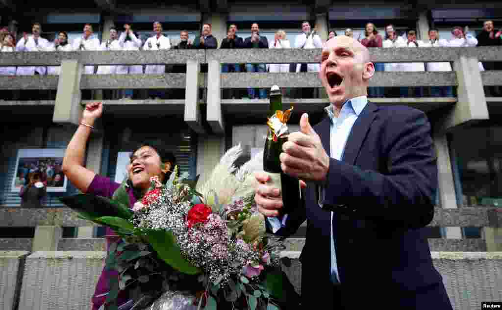 German scientist Benjamin List, who shares the 2021 Nobel Prize in Chemistry together with David MacMillan for the development of asymmetric organocatalysis, celebrates with well-wishers at the Max-Planck-Institute for Coal Research in Muelheim an der Ruhr, Germany.
